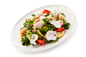 Salad with grilled fish fillet on white background 