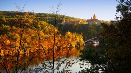 Beautiful castle Veveri in colorful autumn nature, gold leaf, Czech republic