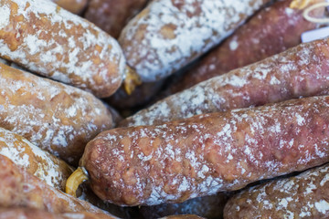 Sausages and ham from dried pork meat in a basketl.