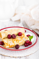 Sweet pancakes with cherry