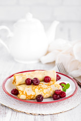 Sweet pancakes with cherry