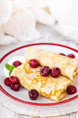 Sweet pancakes with cherry