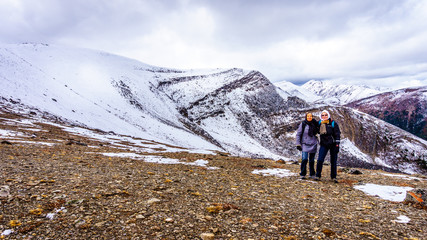 Fototapeta premium Two senior women enjoying the view on top of The Whistlers mountain in Jasper National park in the Canadian Rockies
