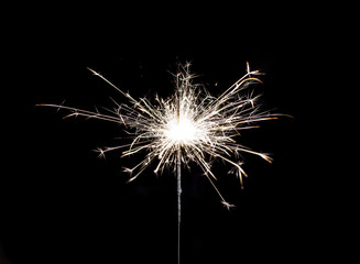 Fototapeta premium Burning sparkler on black background.