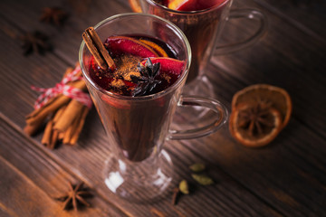 Mulled wine with fruits, cinnamon sticks, anise and decorations