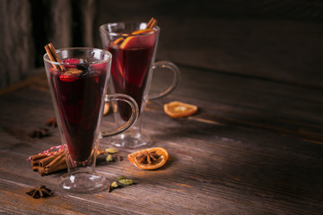 Mulled wine with fruits, cinnamon sticks, anise and decorations
