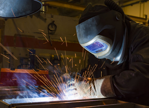 Industrial steel welder in factory