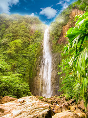 Vertical shot of the colorful Carbet Falls or Les Chutes du Carbet in Basseterre, french tropical...