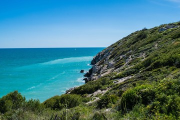 Fototapeta na wymiar Rocky beach, coastline with turquoise sea, Spain