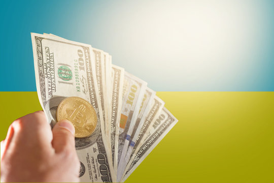 Bitcoin close up on keyboard background the flag of ukraine is shown on bitcoin - Powered by Adobe