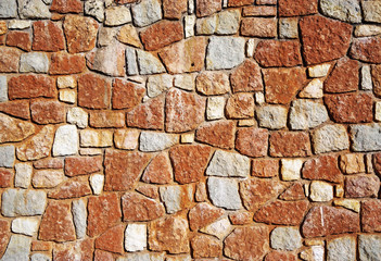 Stone wall texture. Rock wall background. Abstract texture and background for designers. Close up view of rock bricks.; Solid stone wall.