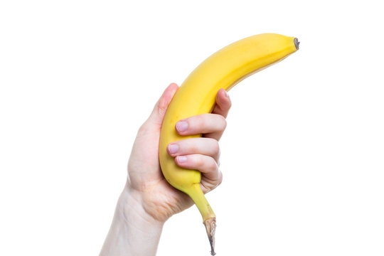 Holding a banana in the hand on white background