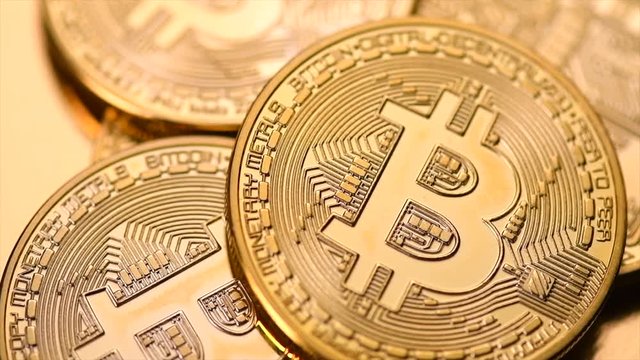 Bitcoin crypto currency. BTC coins. Blockchain technology, Bitcoin mining concept. Rotation 360 degrees. 4K UHD video 3840x2160