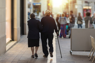 Mature couple of lovers walking hand in hand