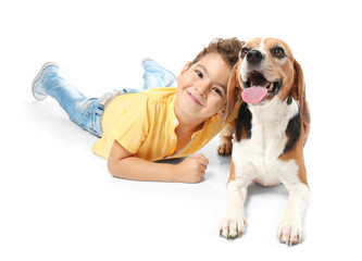 Cute little boy with dog on white background