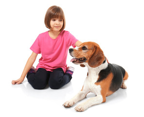 Cute little girl with dog on white background