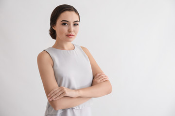 Portrait of beautiful young woman on white background