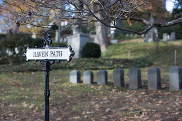 raven path sign in a cemetery