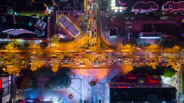 night time illumination shenzhen downtown traffic street crossroad top view 4k timelapse china
