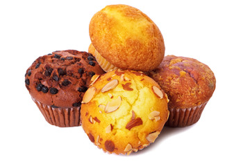 Muffin chocolate chip cup cake or cupcake various flavor several lots many pile heap isolated on white background photo