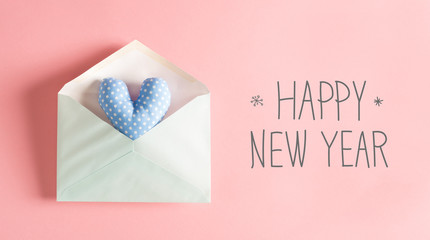 Happy New Year message with a blue heart cushion in an envelope