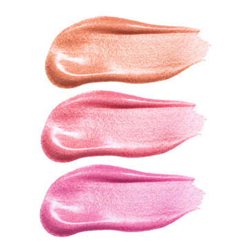 Set of different lip glosses smear samples isolated on white. Smudged makeup product sample
