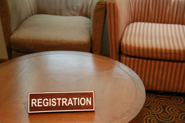 Wooden signs of registration on a table.