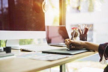 Young creative designer working at office