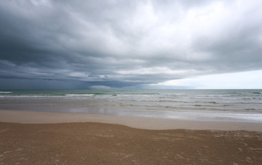 Sea beach and rain cloud sky.