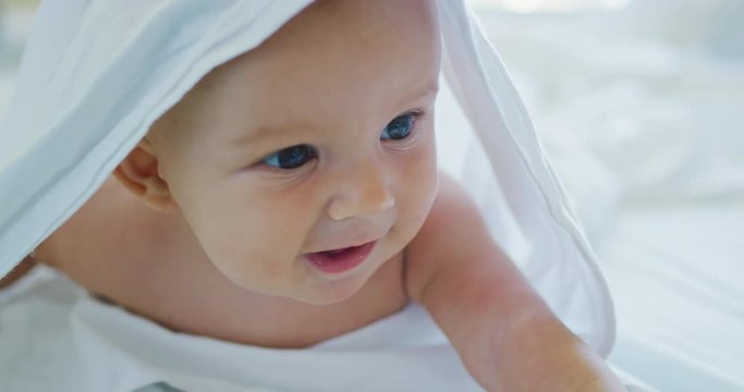 Cute happy little baby laughing and playing