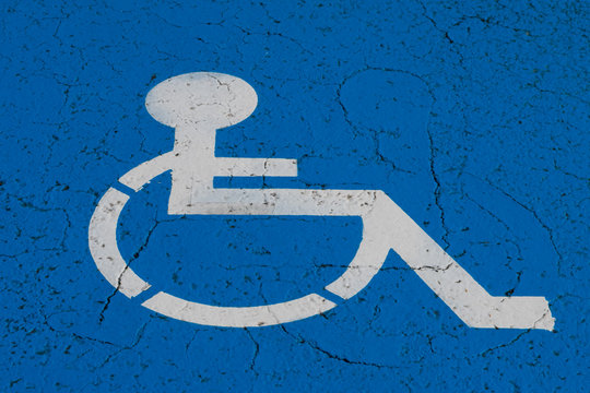 Wheelchair Symbol On Handicap Parking Spot