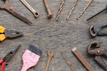 Old tool placed on a wooden floo.
