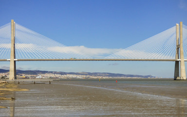 Vasco da Gama bridge and river Tagus at Parque das Nacoes in Lisbon, Portugal