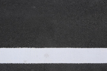 Fototapeta premium surface of the asphalt road and white line.