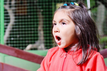 Little latin girl shouting outside.