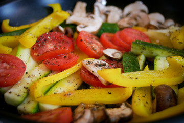 fresh vegetables being sauteed