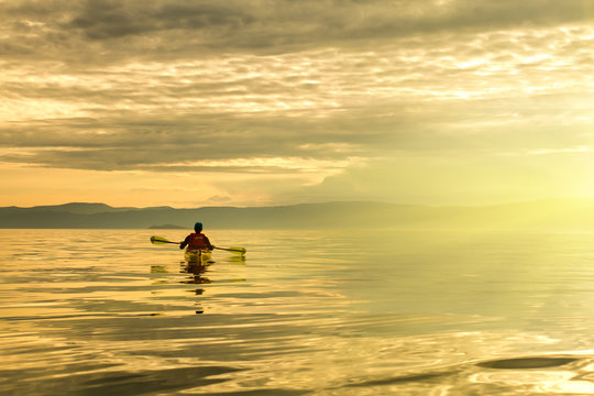 A man in a sea kayak on Lake Baikal