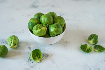 Fresh Brussels sprouts in a white bowl