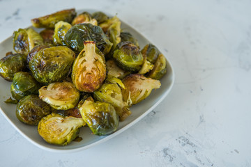 Cooked Brussels sprouts in a white plate
