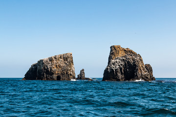 Volcanic rock formations with a sea cave at East Anacapa Island in Channel Islands National Park off the coast of Ventura, California. 