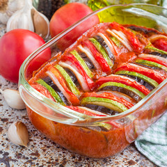 Homemade vegetable ratatouille in glass dish, cooked in oven, square