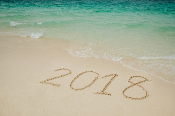 Fototapeta na wymiar New year 2018 on Beach and tropical sea