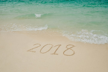 New year 2018 on Beach and tropical sea