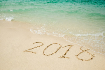 New year 2018 on Beach and tropical sea