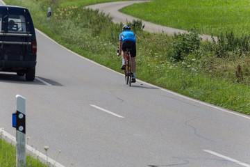 cyclists in a distance view on a summer sunny day © rudolfgeiger