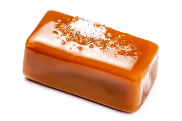 Salted caramel pieces isolated on white background. Golden Butterscotch toffee candy caramels