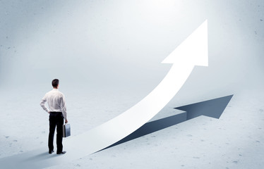 Arrow pointing up with standing salesman