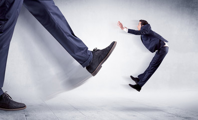 Big leg kicking small man