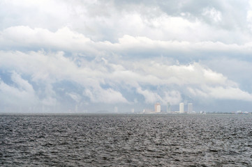 Fototapeta premium Seascape with town at center
