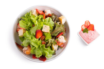 Seafood salad and strawberry sauce isolated on white background